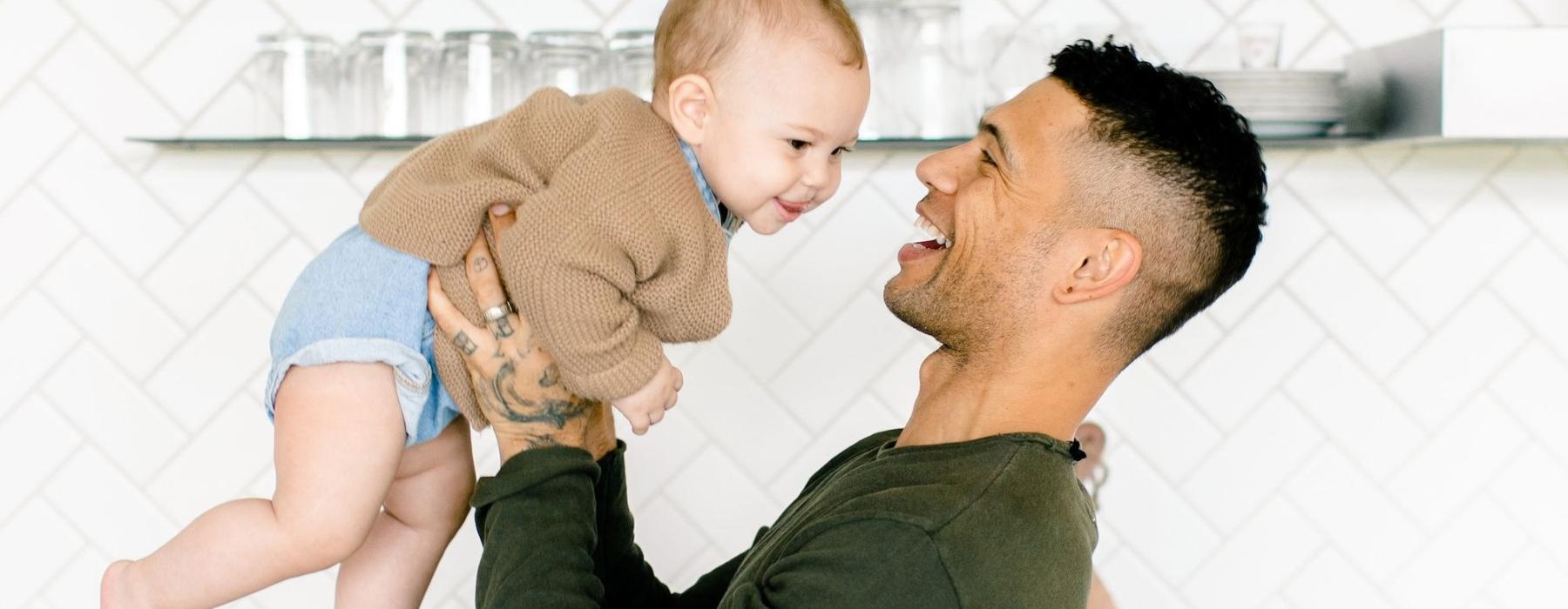 a man holding a baby