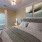 a bedroom with a bed and a plant