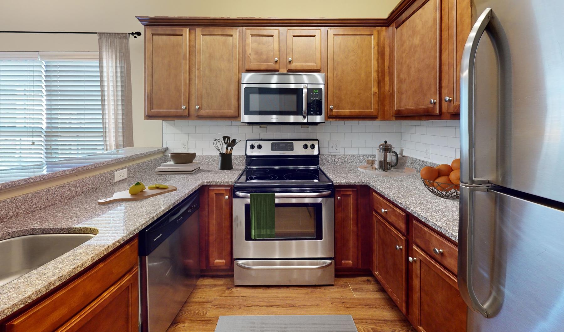 a kitchen with wooden cabinets