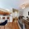 a living room with a large dining table and a couch