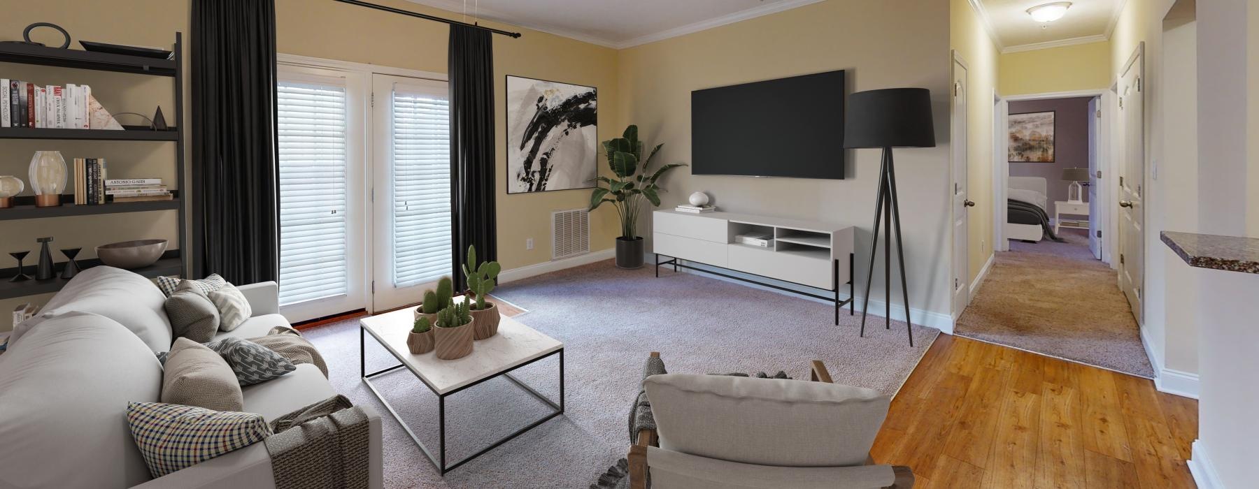 a living room with a tv and furniture
