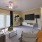 a living room with a tv and furniture