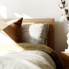 modern decor on a table beside a bed
