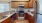 a kitchen with wooden cabinets