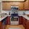 a kitchen with wooden cabinets